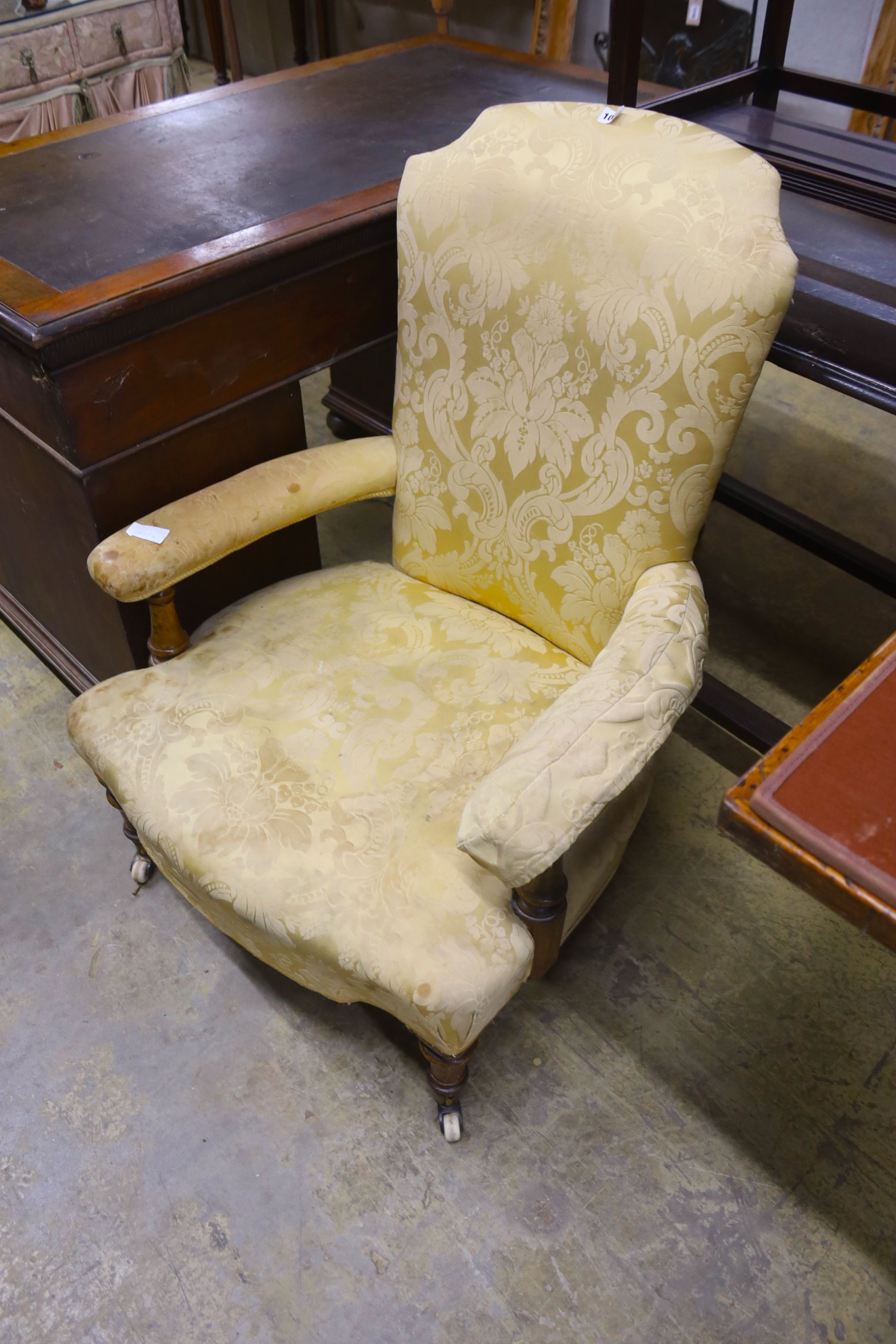 A Victorian upholstered open armchair, width 70cm, depth 76cm, height 94cm